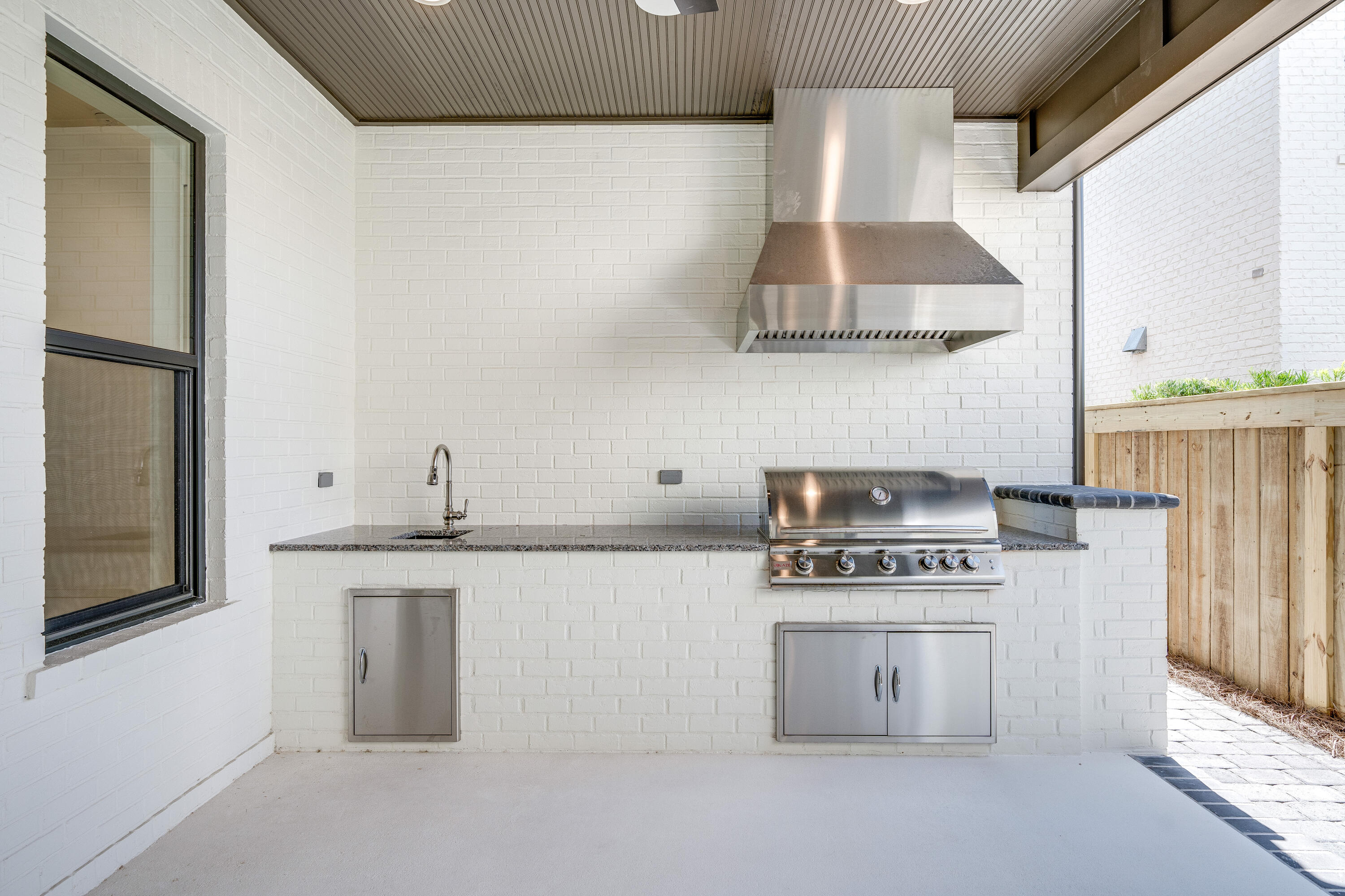 406 Ridgewalk Circle Santa Rosa Beach, FL 32459 - Photo 21 of 69 a kitchen with stainless steel appliances white cabinets and a stove