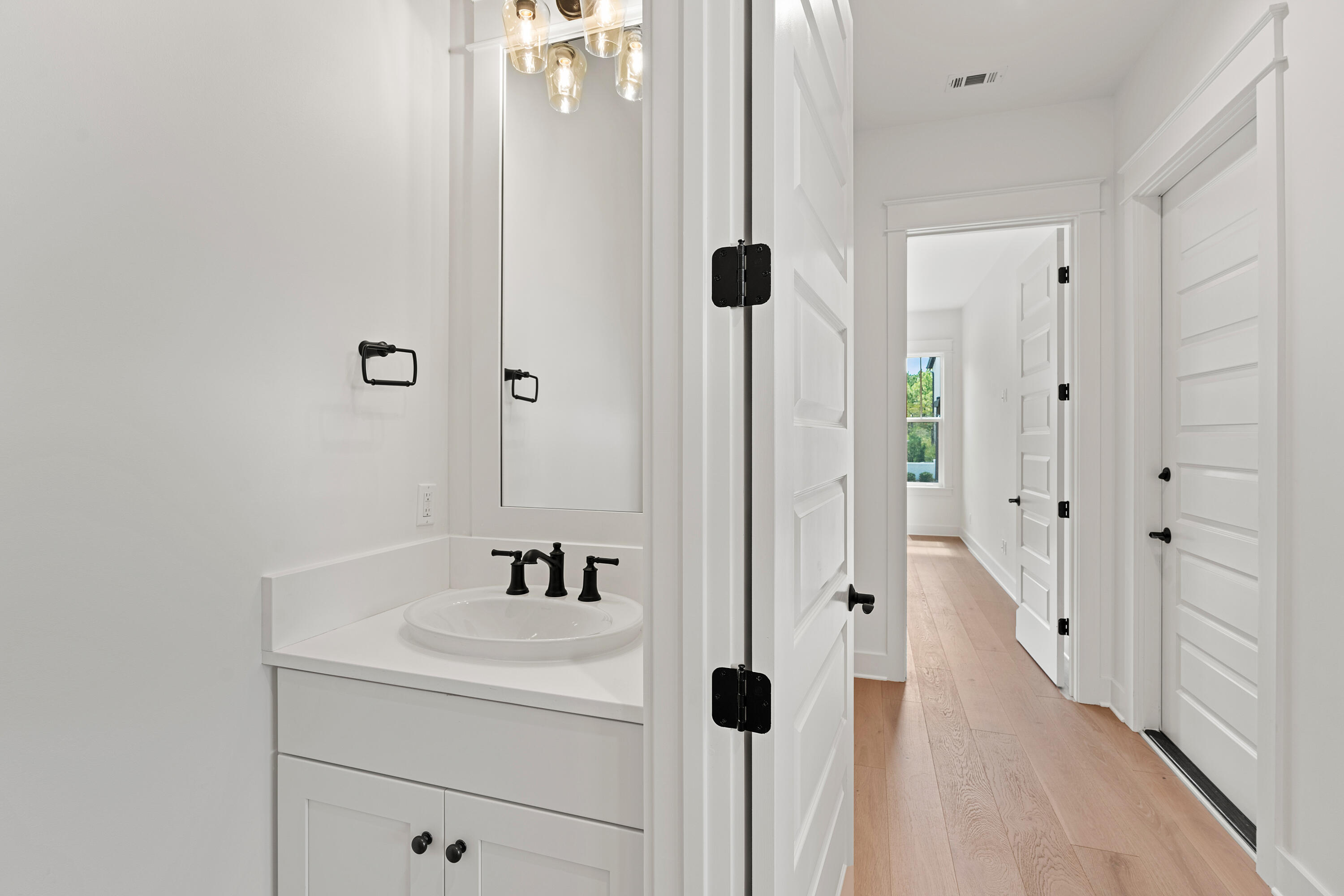 406 Ridgewalk Circle Santa Rosa Beach, FL 32459 - Photo 25 of 69 a bathroom with a sink and a mirror