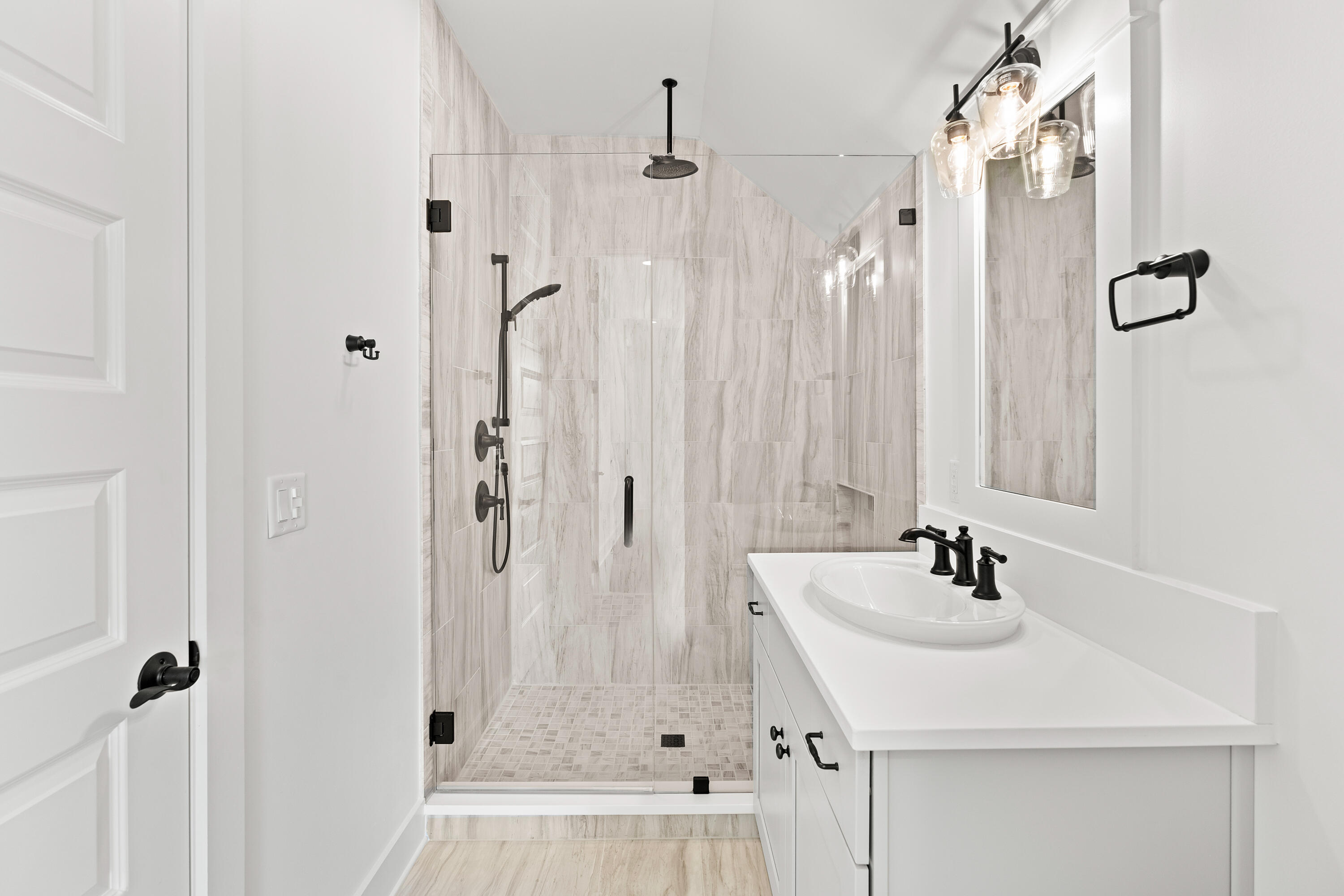 406 Ridgewalk Circle Santa Rosa Beach, FL 32459 - Photo 38 of 69 a bathroom with a sink a shower and a mirror