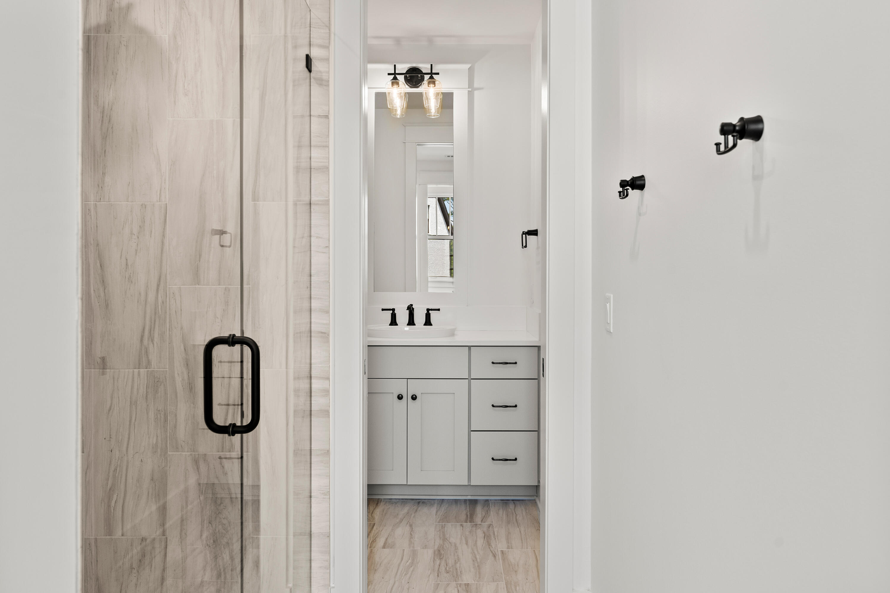 406 Ridgewalk Circle Santa Rosa Beach, FL 32459 - Photo 42 of 69 a bathroom with a shower sink and mirror