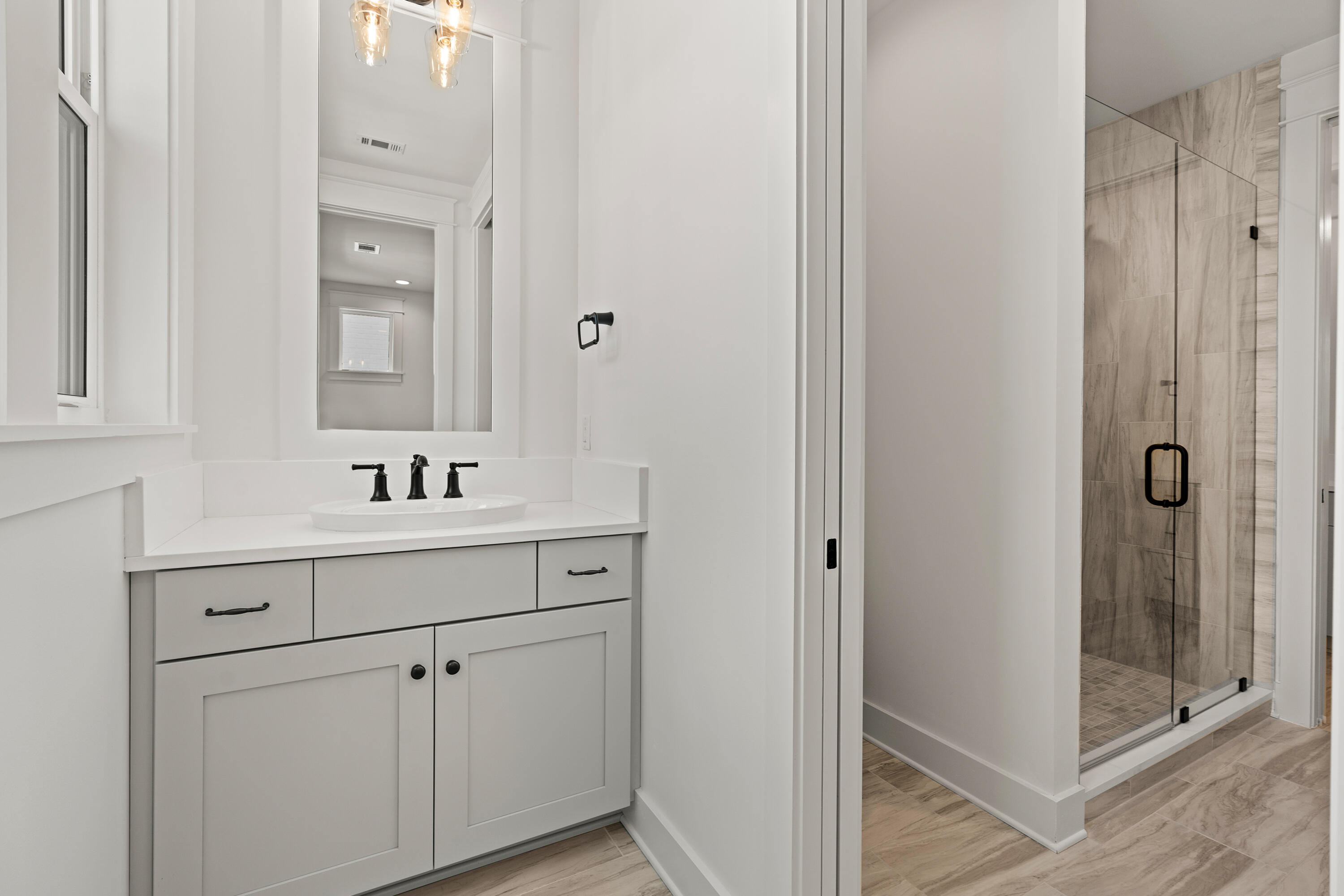 406 Ridgewalk Circle Santa Rosa Beach, FL 32459 - Photo 43 of 69 a bathroom with a sink and mirror