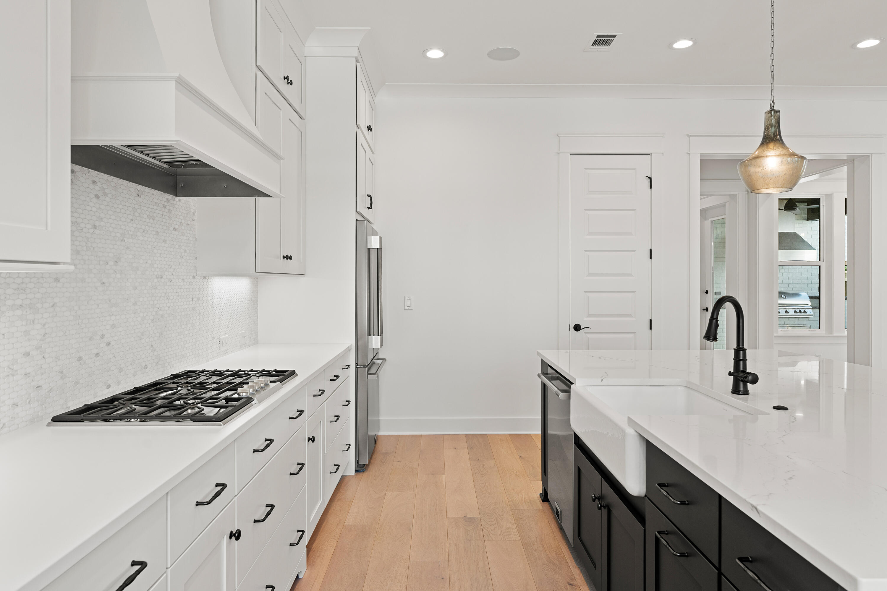 406 Ridgewalk Circle Santa Rosa Beach, FL 32459 - Photo 7 of 69 a kitchen with kitchen island a sink stainless steel appliances and cabinets