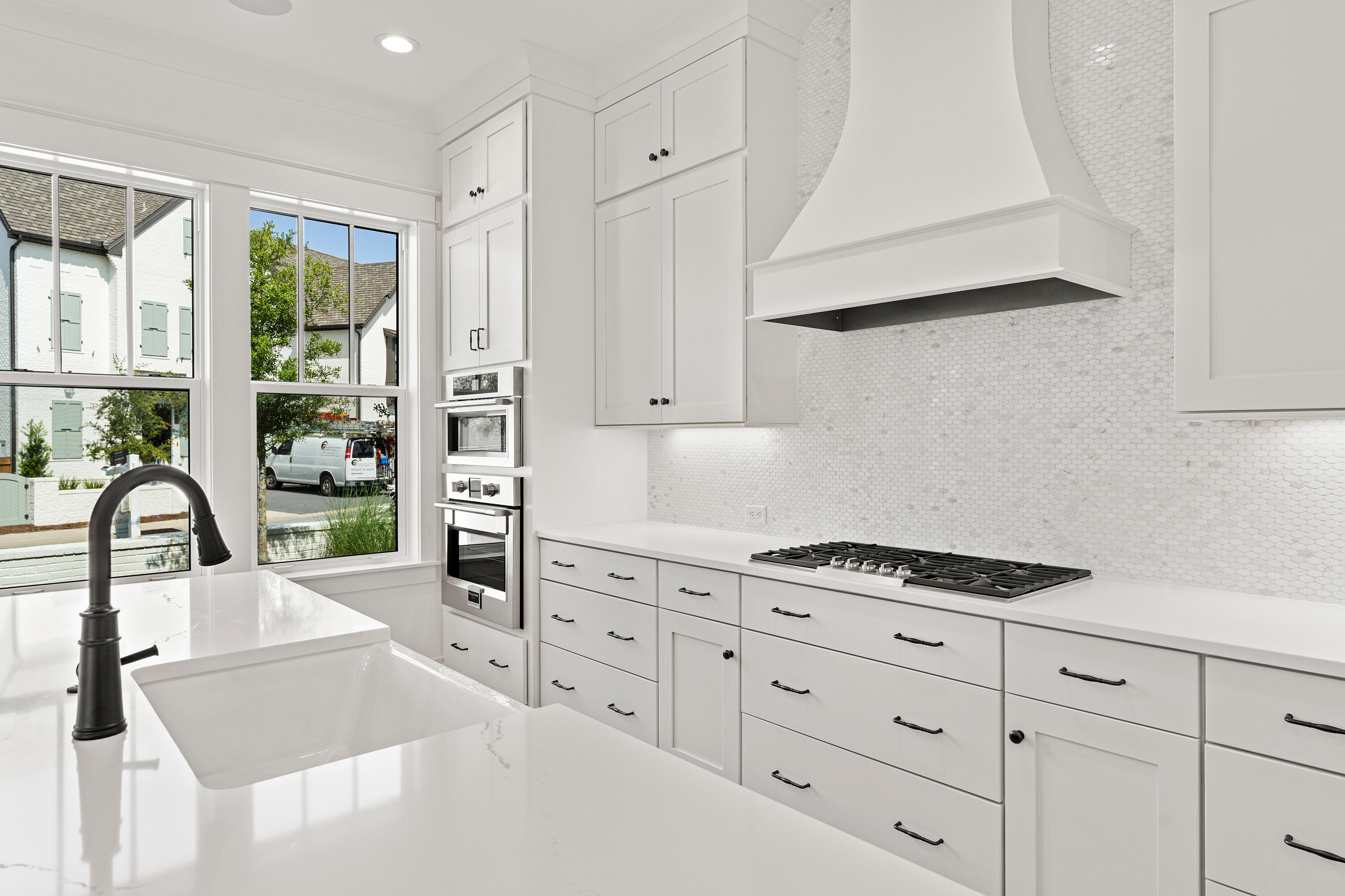 406 Ridgewalk Circle Santa Rosa Beach, FL 32459 - Photo 10 of 69 a kitchen with granite countertop a stove a sink and a refrigerator