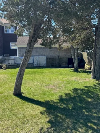 a swimming pool with wooden fence