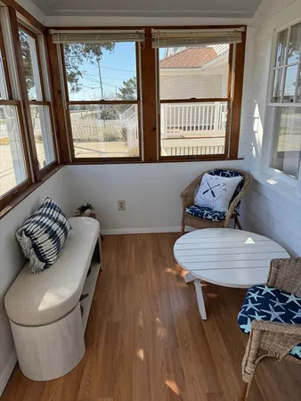 a living room with furniture and a window