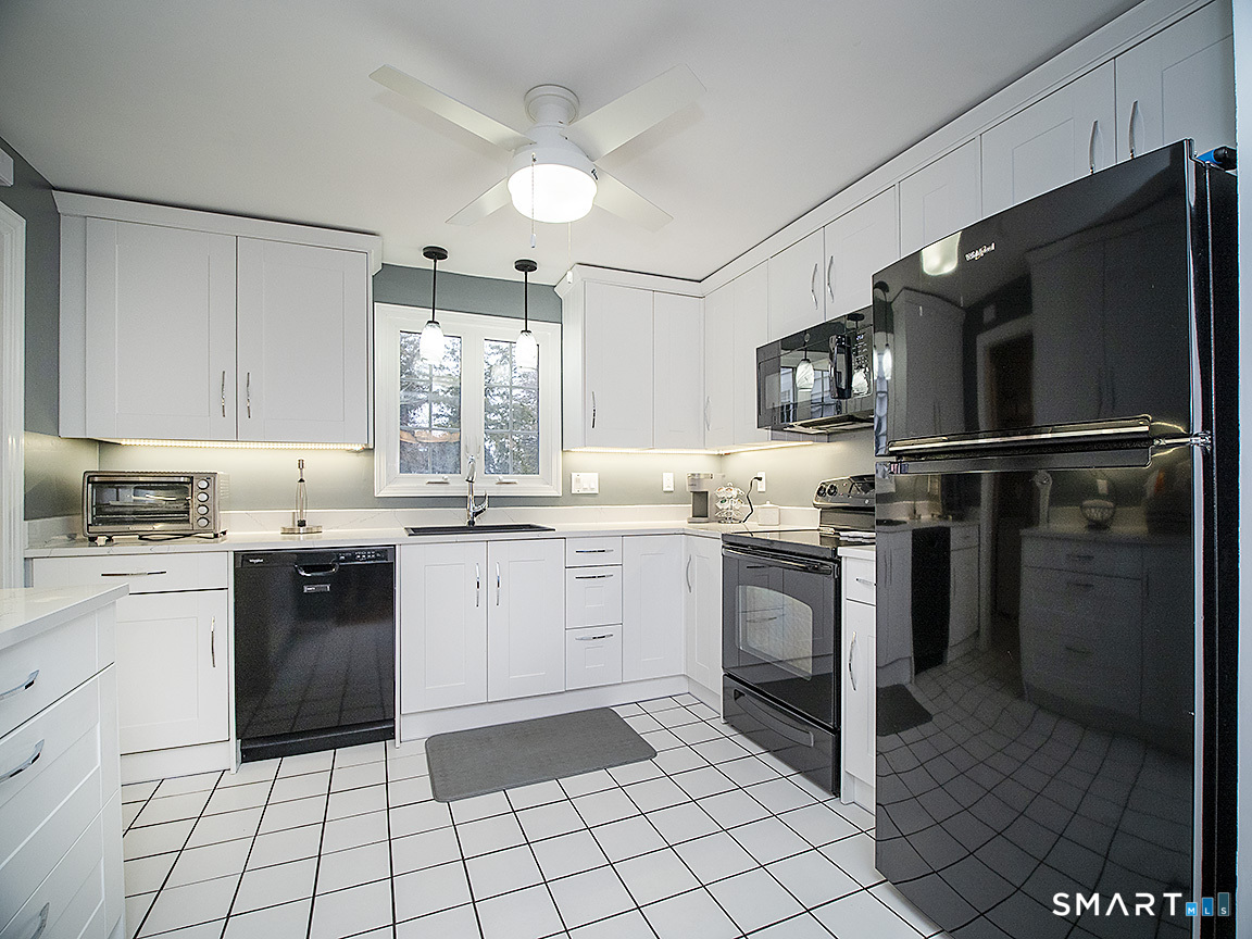 71 Vista Road North Haven, CT 06473 - Photo 11 of 32 a kitchen with a sink cabinets and stainless steel appliances
