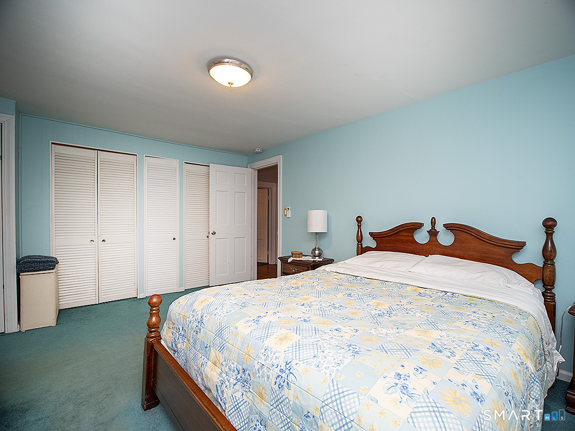 71 Vista Road North Haven, CT 06473 - Photo 18 of 32 a bedroom with a bed and a cabinets