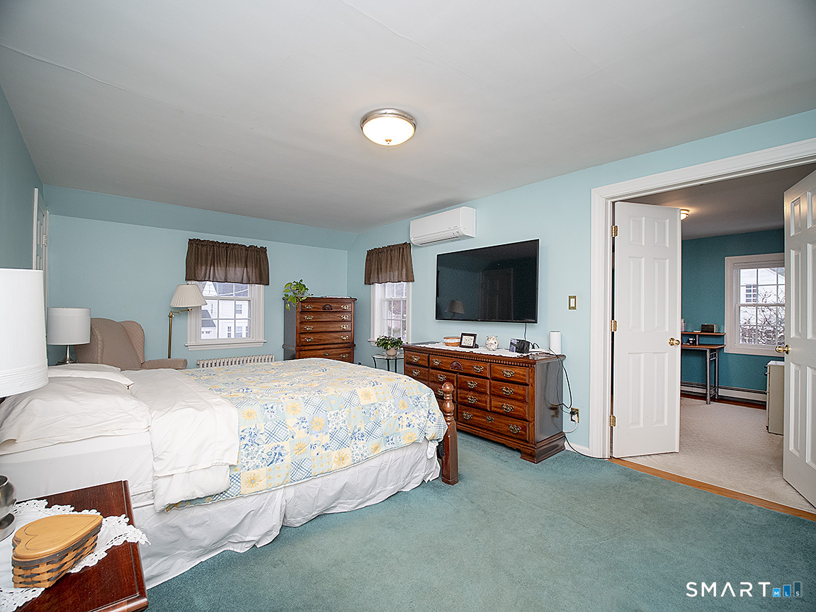 71 Vista Road North Haven, CT 06473 - Photo 19 of 32 a bedroom with a bed and flat screen tv