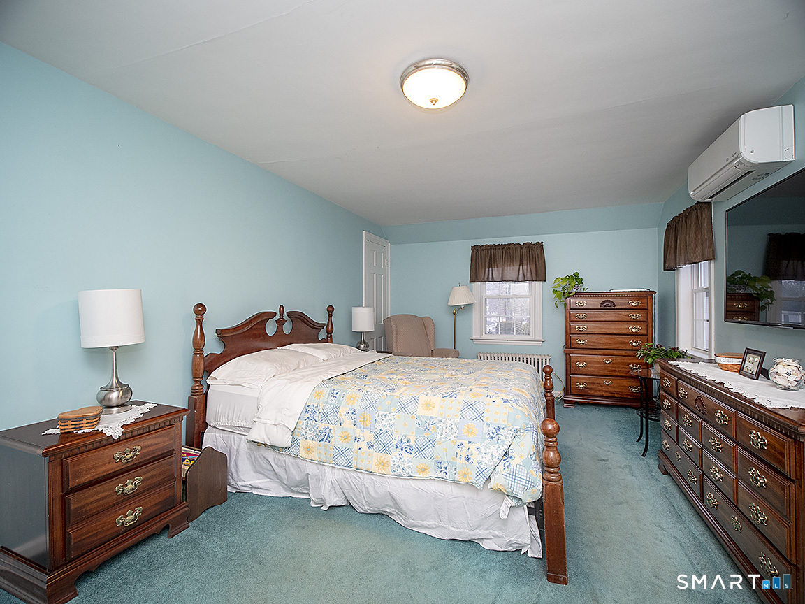 71 Vista Road North Haven, CT 06473 - Photo 20 of 32 a bed room with bed and a tv