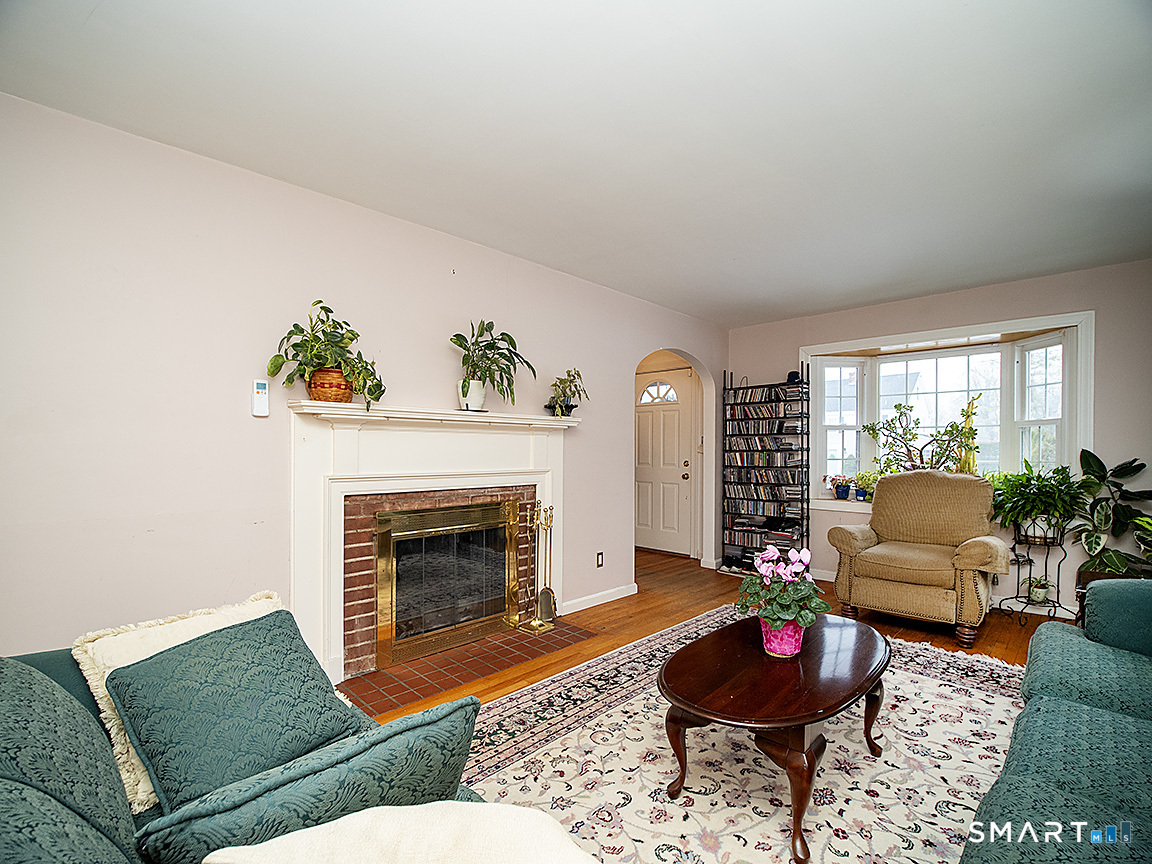 71 Vista Road North Haven, CT 06473 - Photo 6 of 32 a living room with furniture and a fireplace