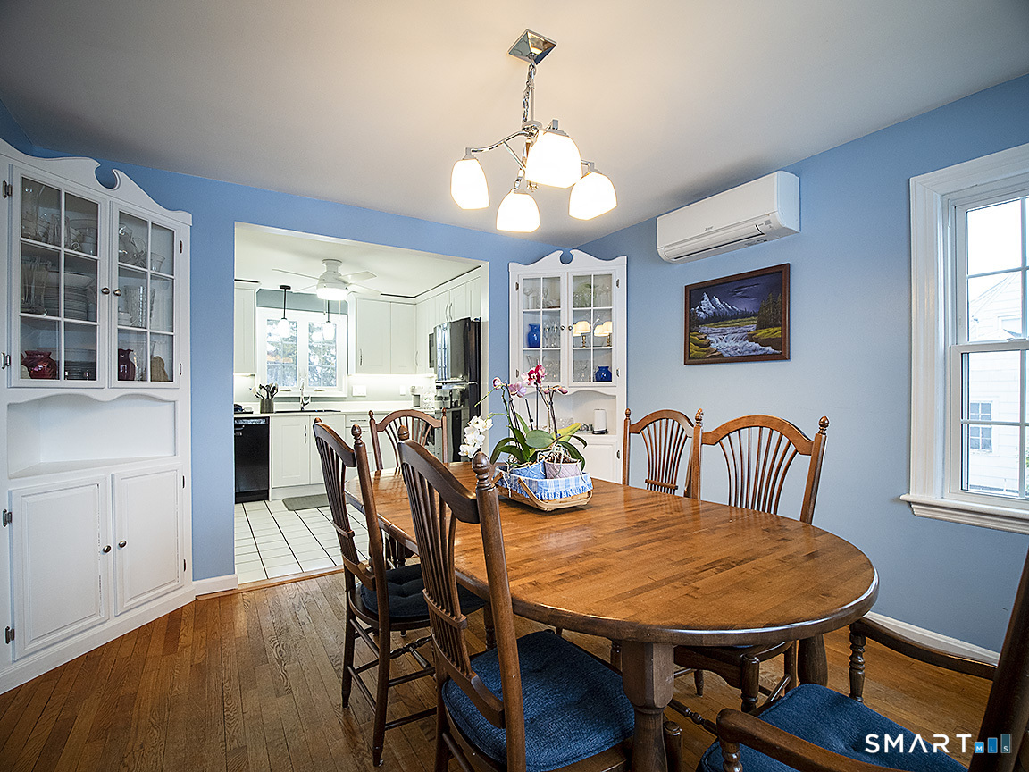 71 Vista Road North Haven, CT 06473 - Photo 8 of 32 a view of a dining room with furniture window and wooden floor