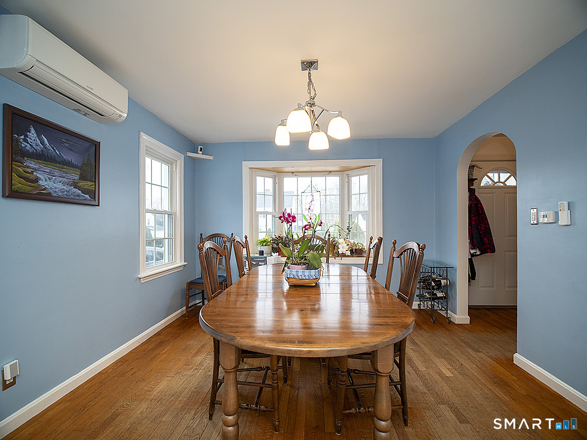 71 Vista Road North Haven, CT 06473 - Photo 9 of 32 a view of a dining room with furniture window and wooden floor