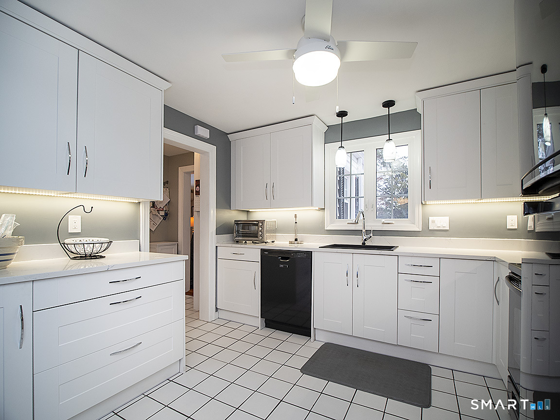 71 Vista Road North Haven, CT 06473 - Photo 10 of 32 a kitchen with a white cabinets and window