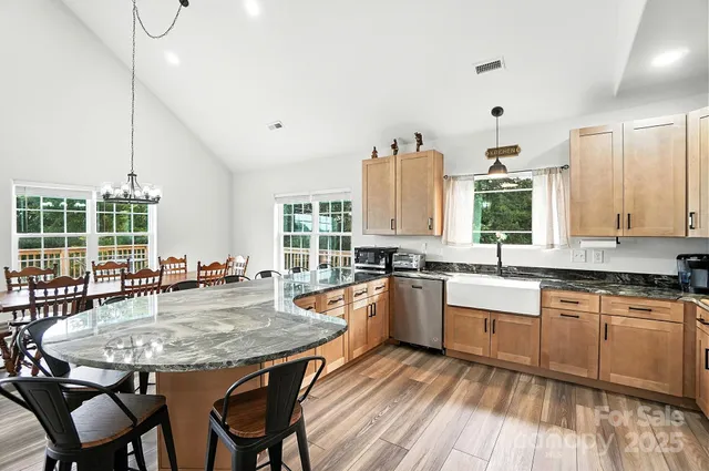 a view of balcony with wooden floor