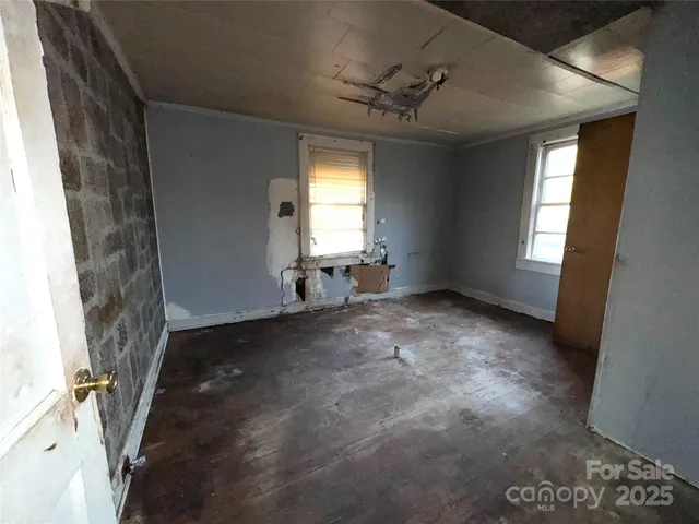 a view of empty room with windows