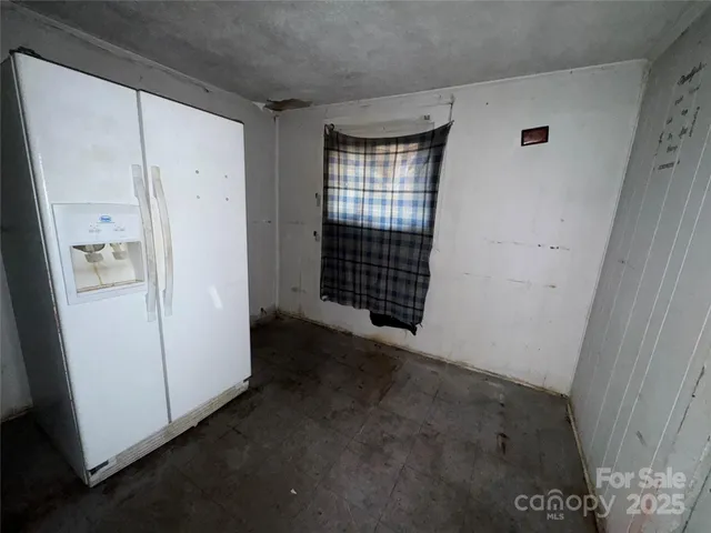 a view of empty room with windows