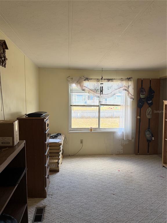 8156 North Princess Avenue Dunnellon, FL 34433 - Photo 19 of 26 a room with furniture and a window