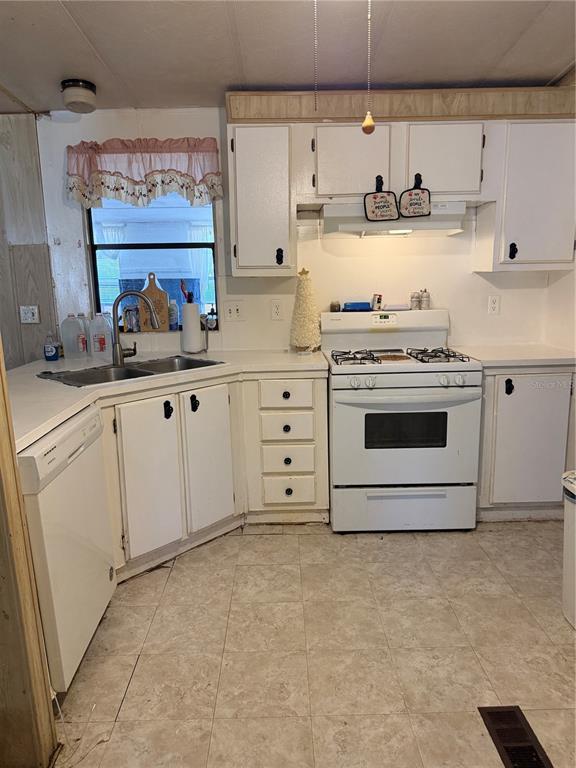 8156 North Princess Avenue Dunnellon, FL 34433 - Photo 10 of 26 a kitchen with cabinets appliances and a sink