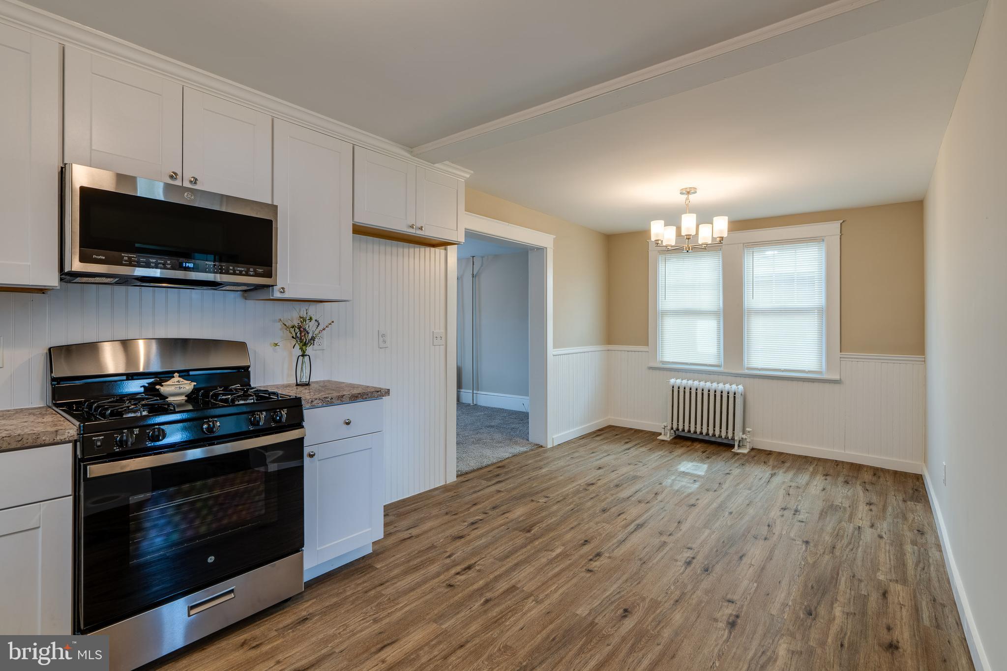 309 South Cherry Street Manheim, PA 17545 - Photo 15 of 34 a kitchen with stainless steel appliances a stove a microwave and cabinets