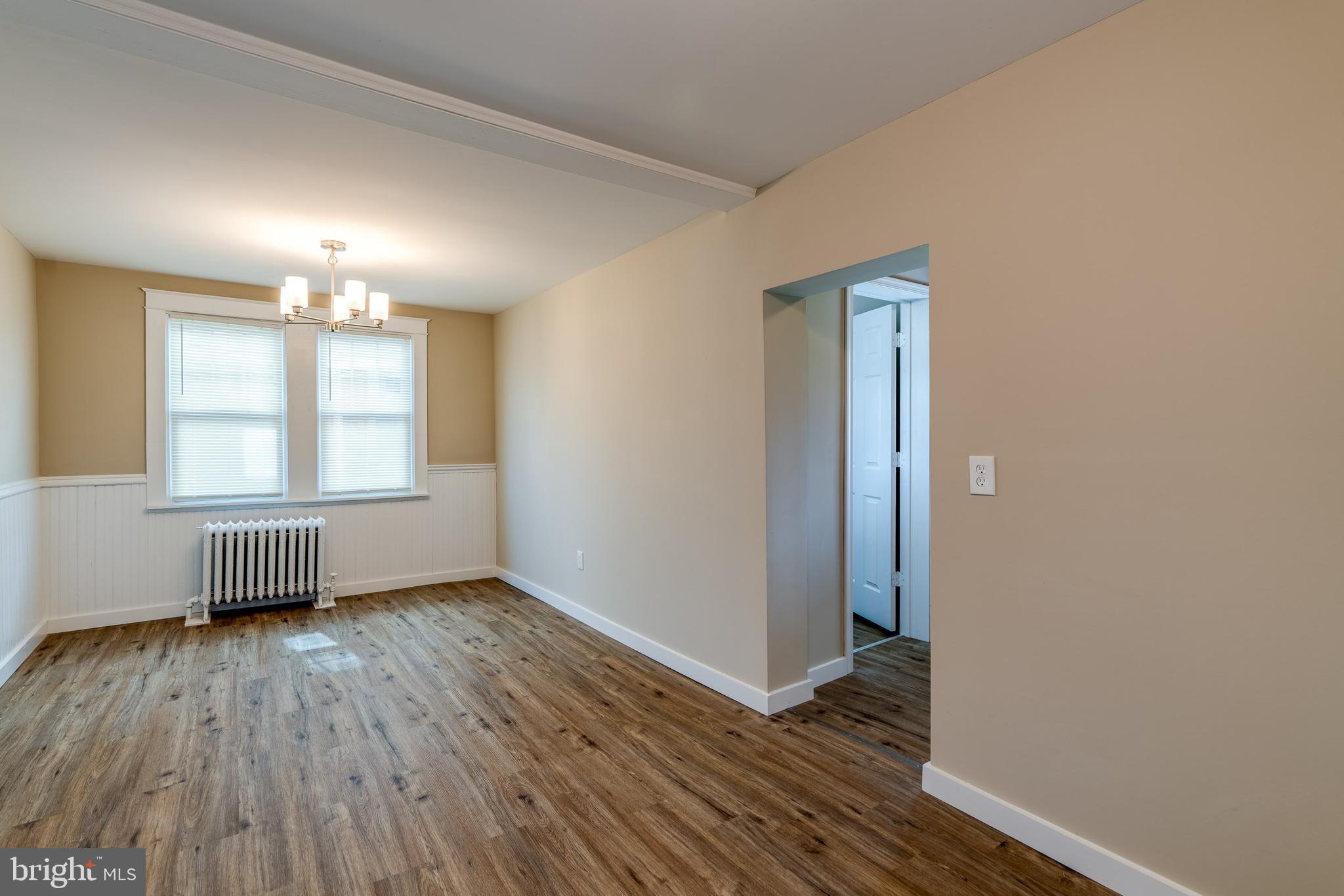 309 South Cherry Street Manheim, PA 17545 - Photo 17 of 34 an empty room with wooden floor cabinet and windows