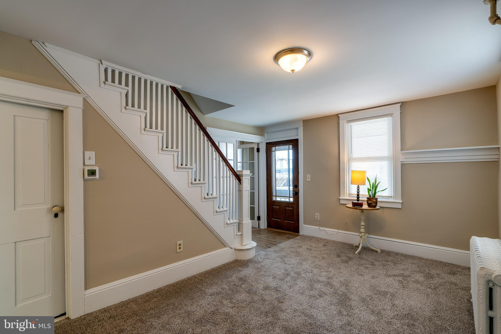 309 South Cherry Street Manheim, PA 17545 - Photo 8 of 34 a view of an empty room with stairs and a window