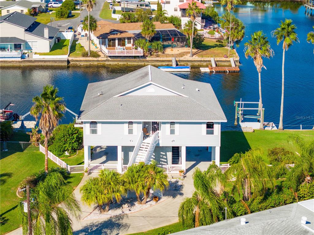an aerial view of a house with a swimming pool