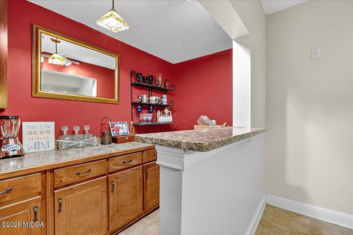 518 River Overlook Forsyth, GA 31029 - Photo 44 of 96 a kitchen with stainless steel appliances granite countertop a sink and a microwave