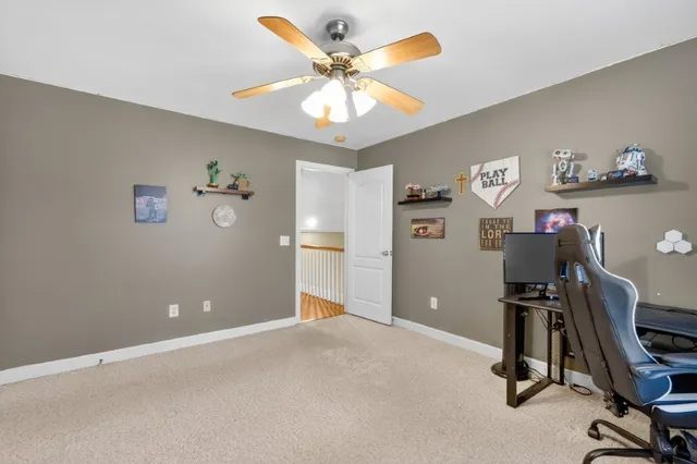 a view of a workspace with furniture and workspace