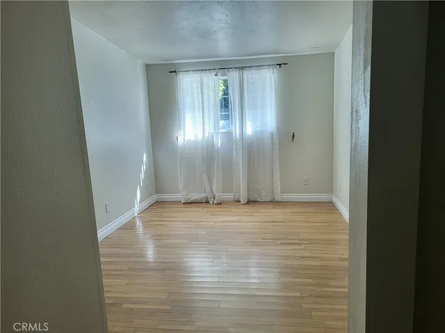 a view of a entryway with wooden floor