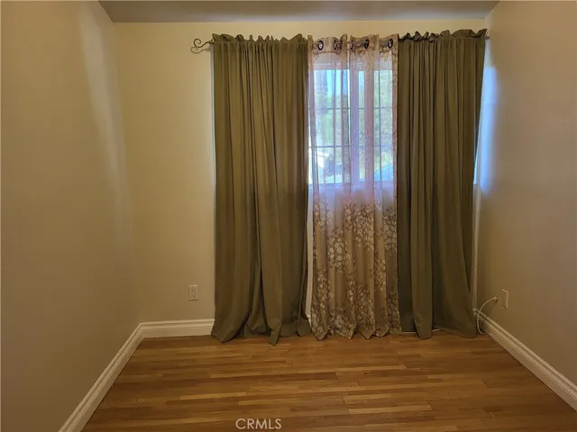 a bathroom with a sink and mirror with toilet