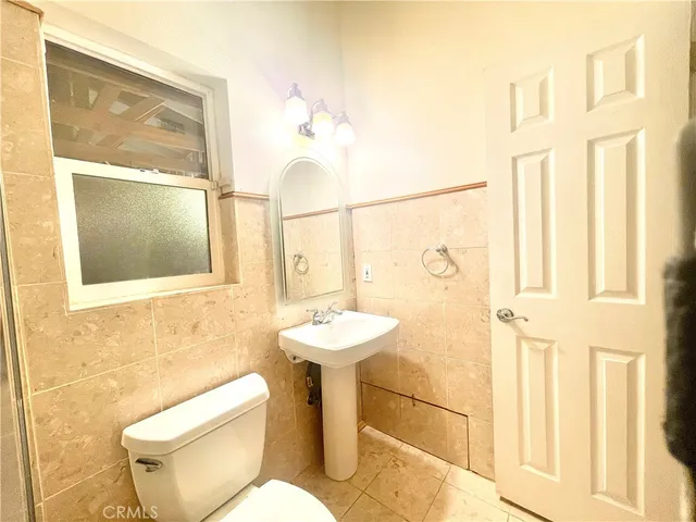 a bathroom with a tub and shower