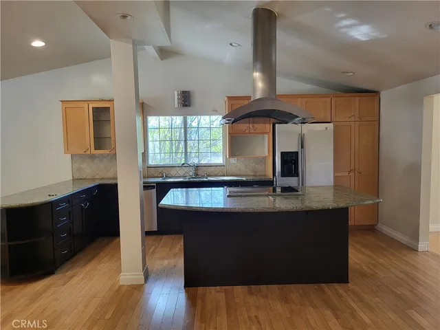 a kitchen with a refrigerator a sink and dishwasher
