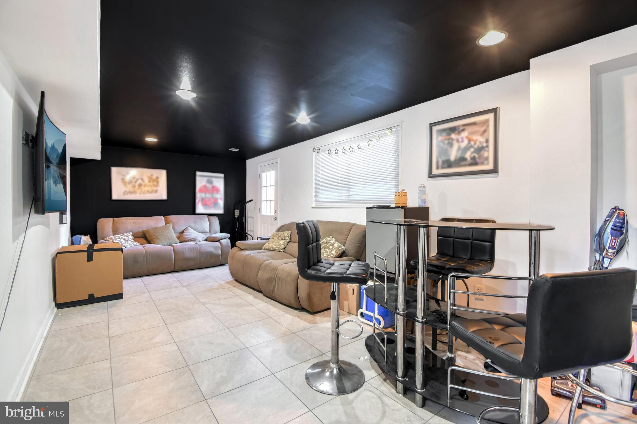 1104 Caddington Avenue Silver Spring, MD 20901 - Photo 14 of 23 a living room with furniture and flat screen tv