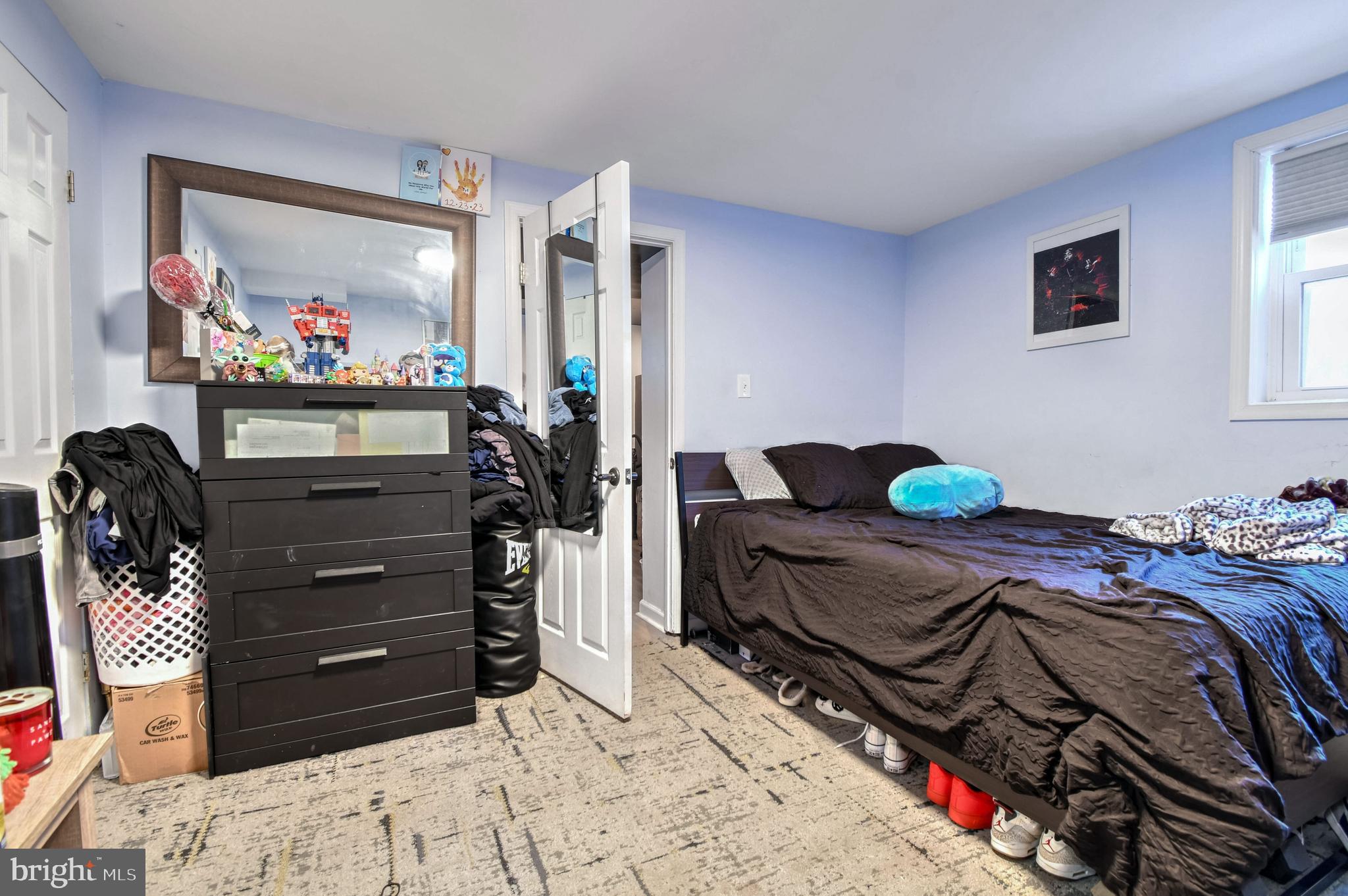 1104 Caddington Avenue Silver Spring, MD 20901 - Photo 18 of 23 a bed room with a bed and a television