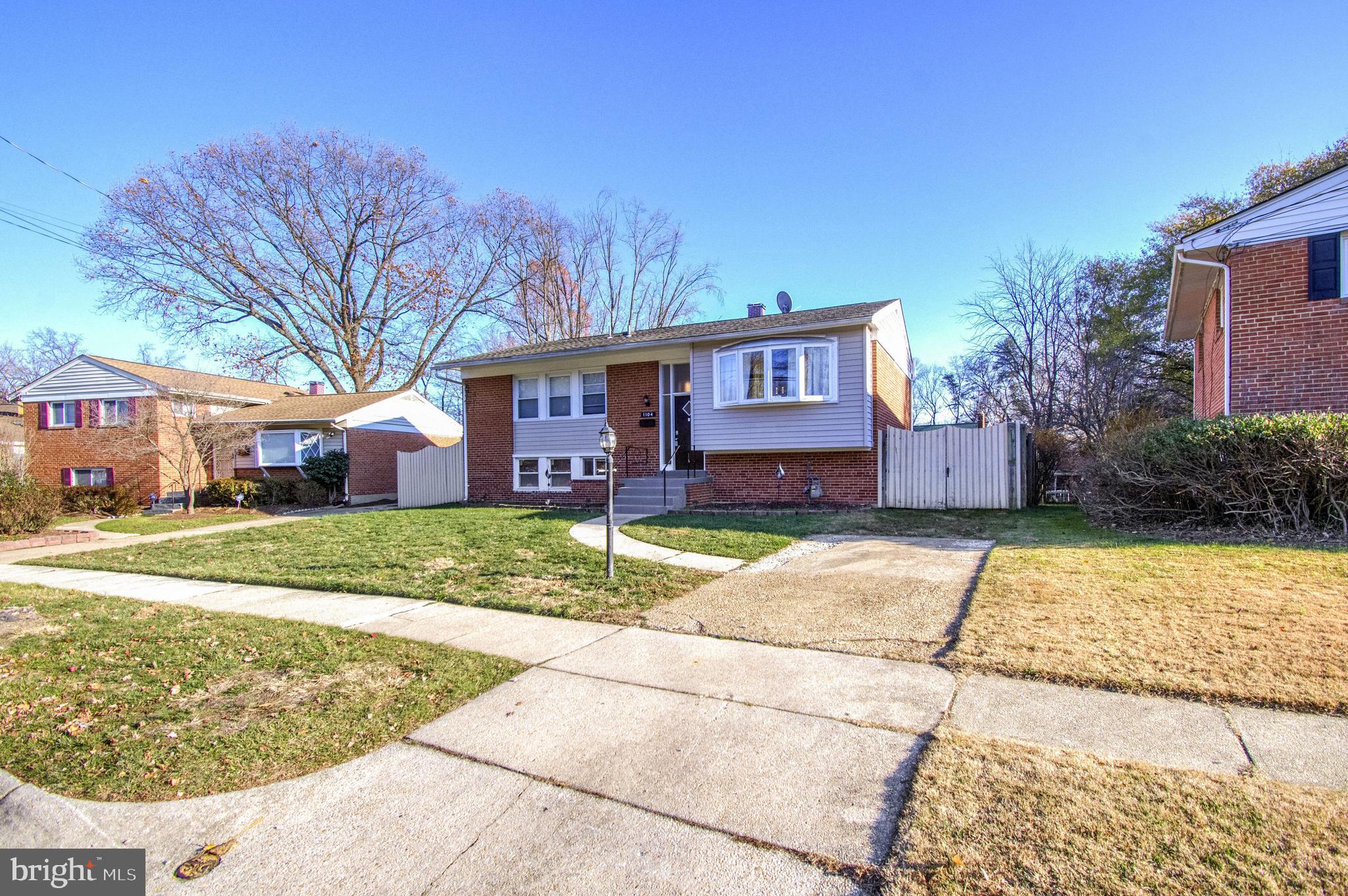 1104 Caddington Avenue Silver Spring, MD 20901 - Photo 7 of 23 a view of a house with a yard
