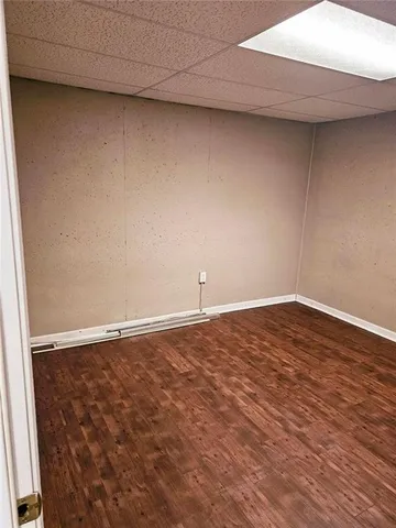 a view of a livingroom with furniture and a window
