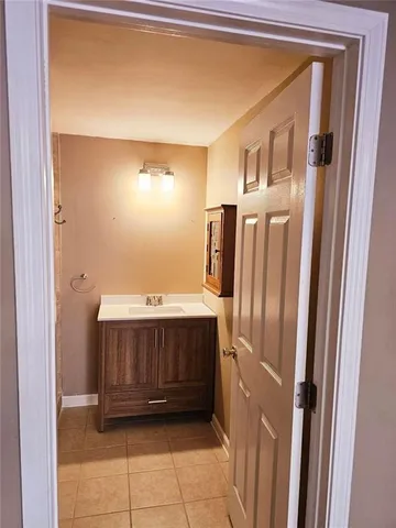 a white toilet sitting next to a shower