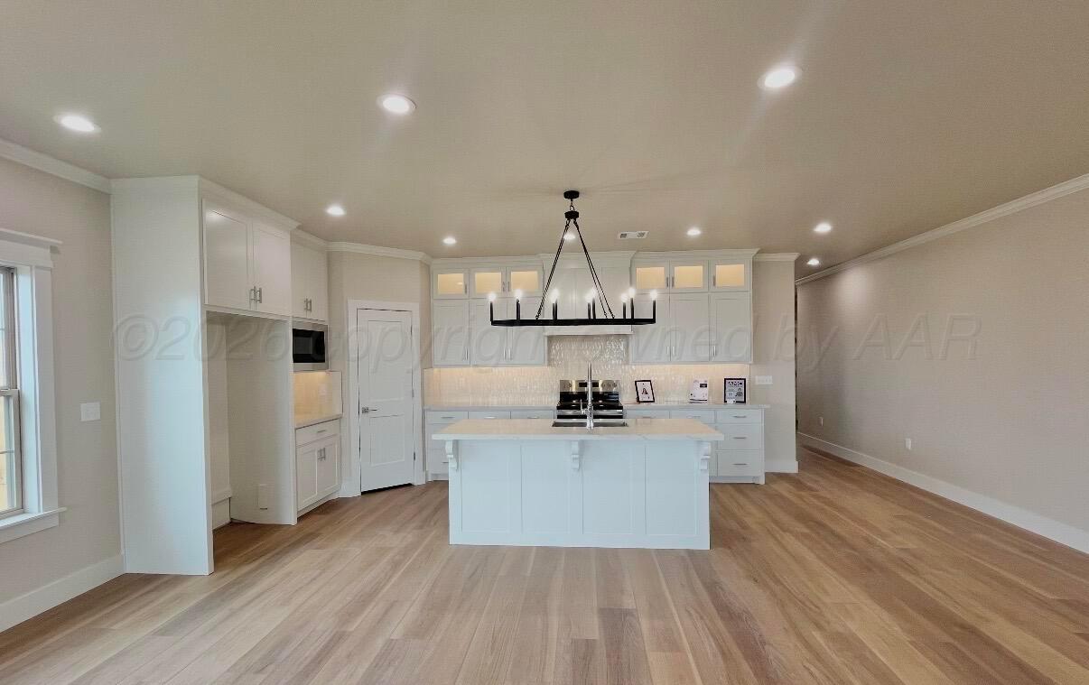 19000 Taurus Trail Canyon, TX 79015 - Photo 5 of 10 a kitchen with stainless steel appliances a refrigerator and a stove top oven