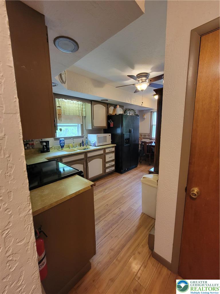 320 Hillside Street Forest City, PA 18421 - Photo 7 of 24 a kitchen with stainless steel appliances a refrigerator and a stove