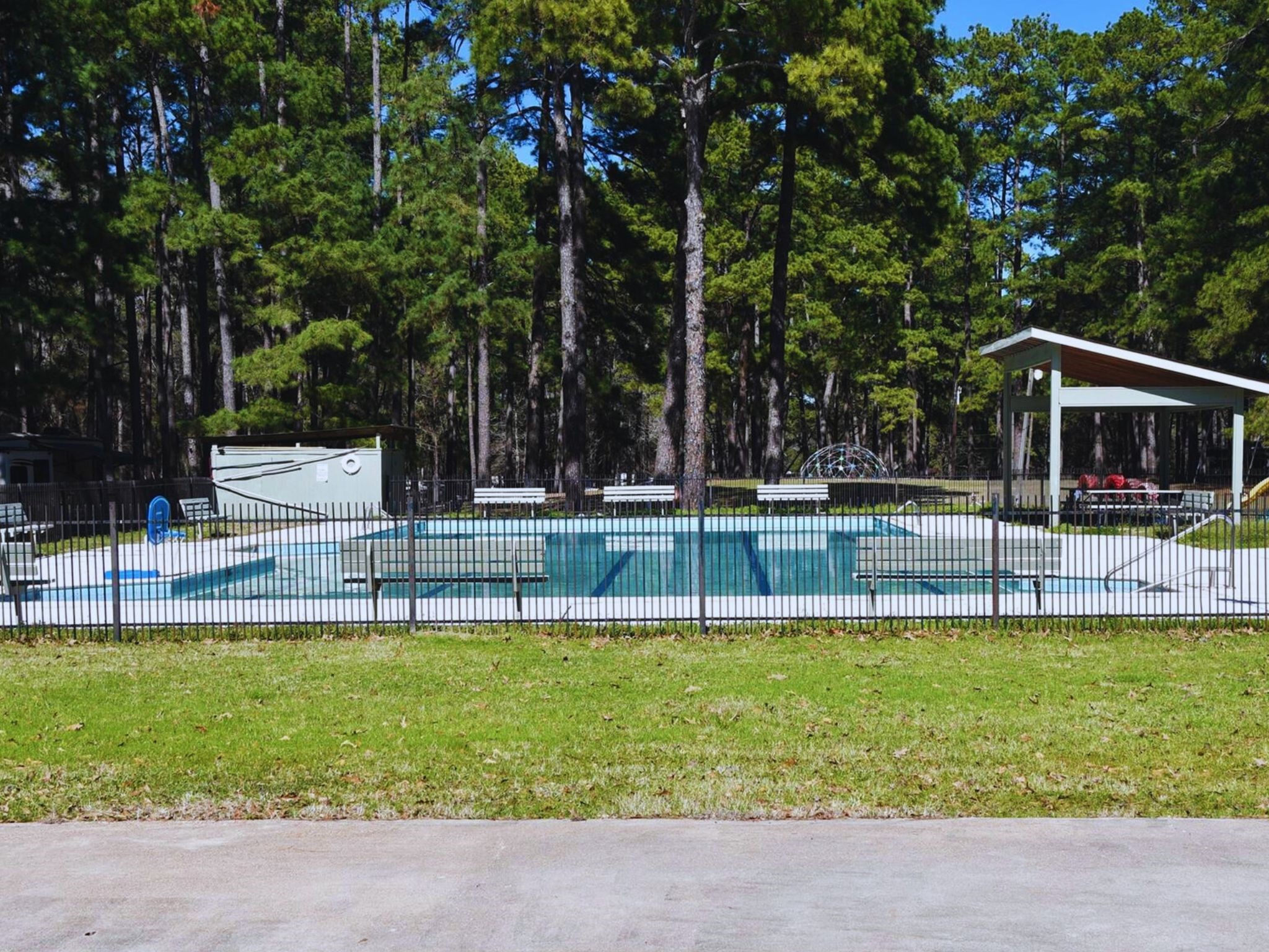 56-58 Cherry Hills Trinity, TX 75862 - Photo 7 of 10 a view of a swimming pool with a yard