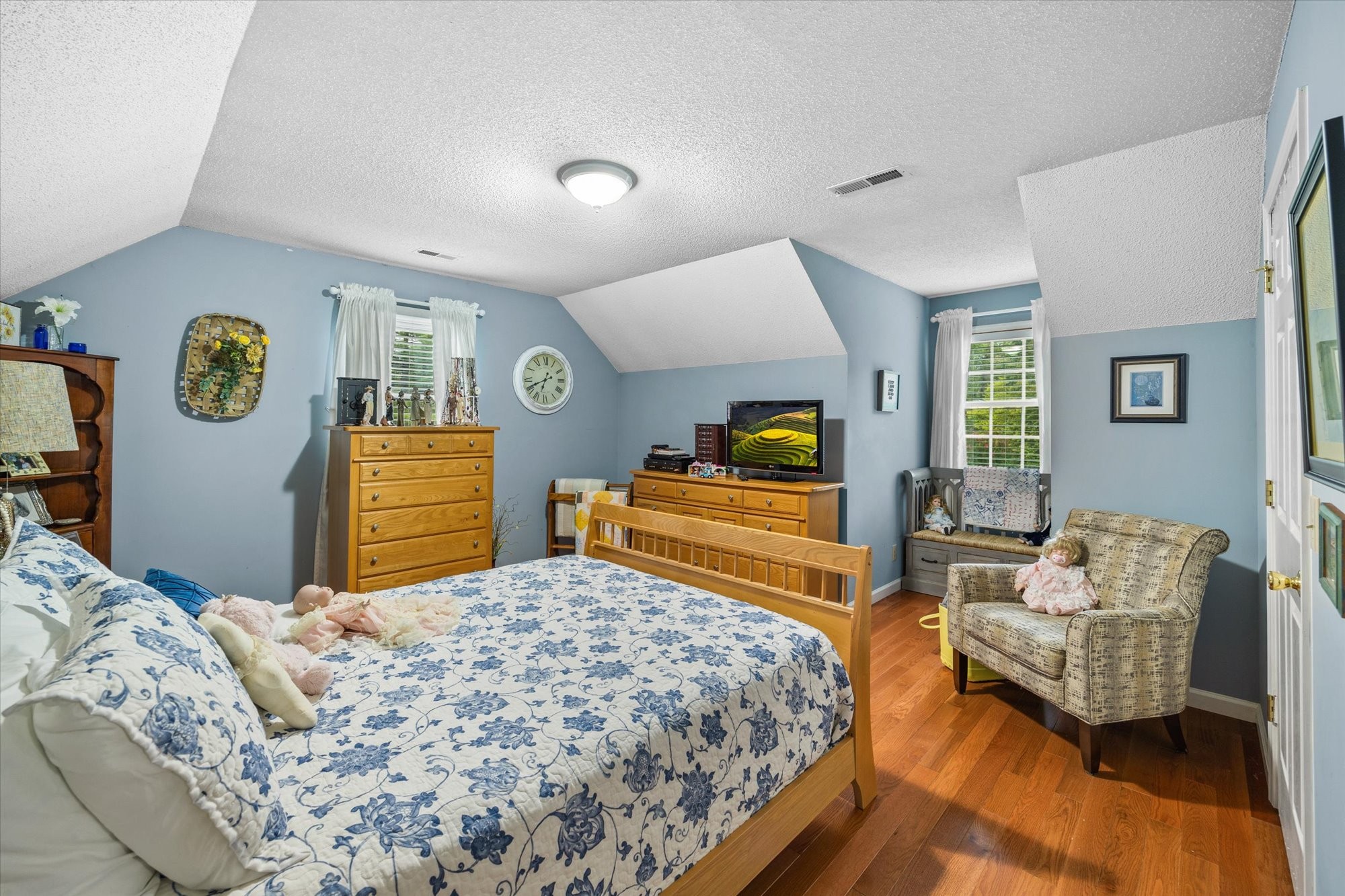 7214 Sarah Thomas Road Silver Point, TN 38582 - Photo 19 of 52 a bedroom with a bed and wooden floor