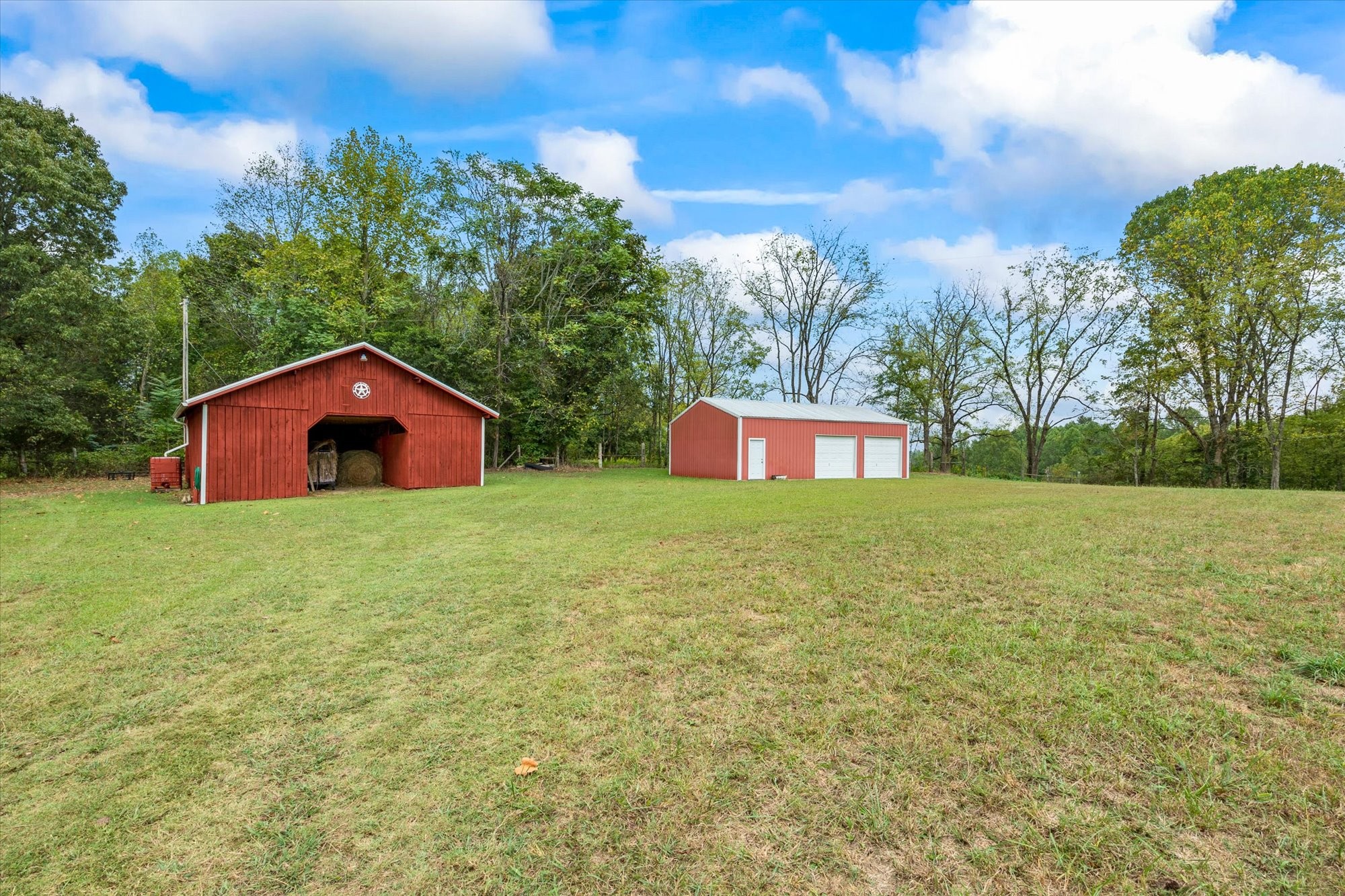 7214 Sarah Thomas Road Silver Point, TN 38582 - Photo 23 of 52 a house is sitting in middle of the green field