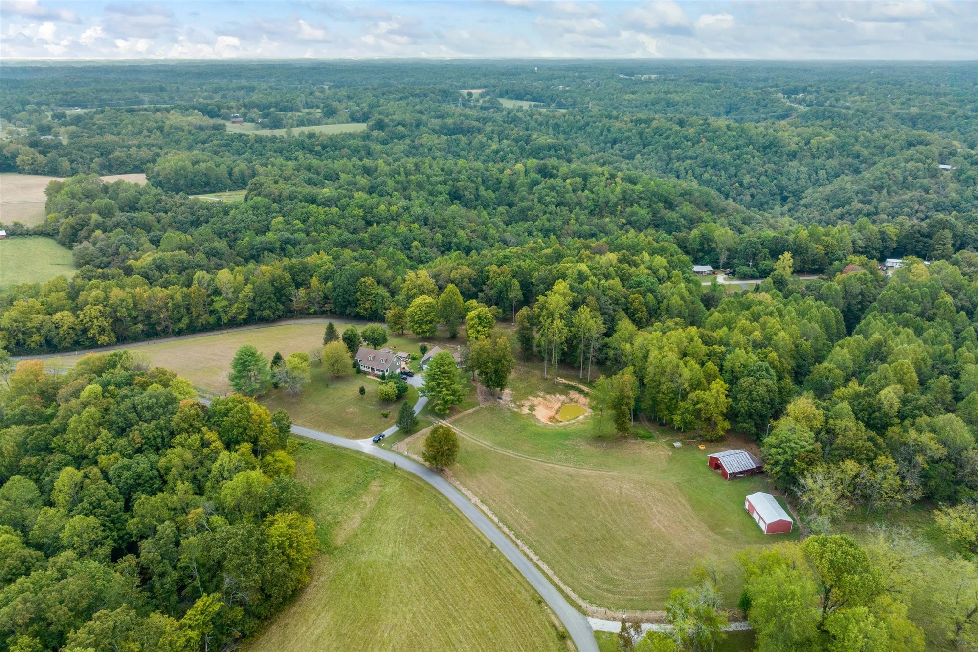 7214 Sarah Thomas Road Silver Point, TN 38582 - Photo 32 of 52 an aerial view of residential houses with outdoor space and trees