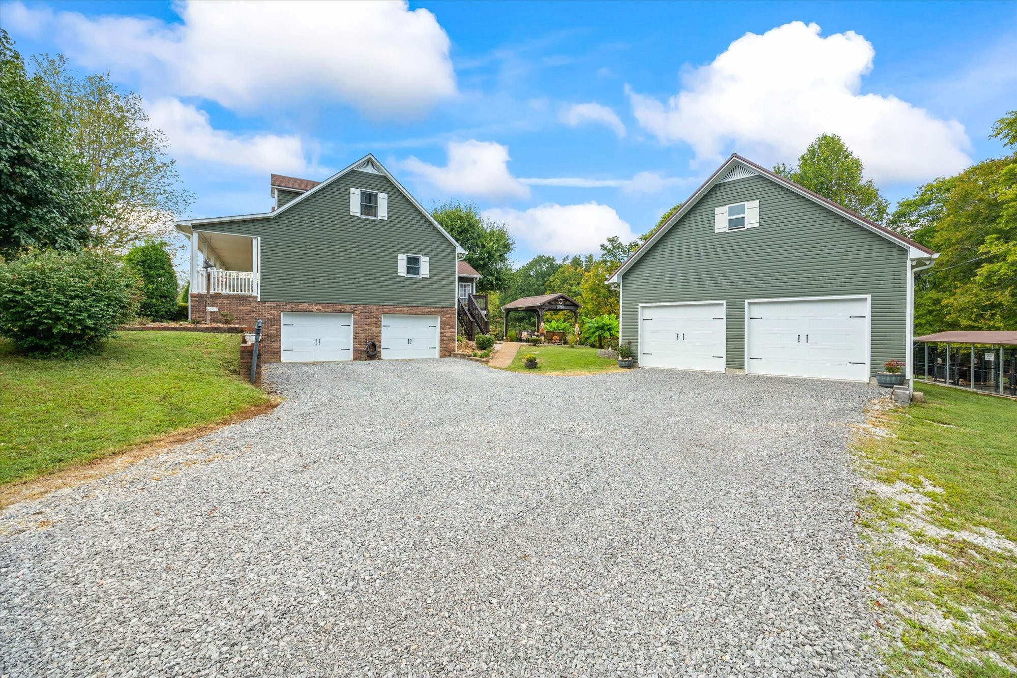 7214 Sarah Thomas Road Silver Point, TN 38582 - Photo 39 of 52 a front view of a house with a yard and garage