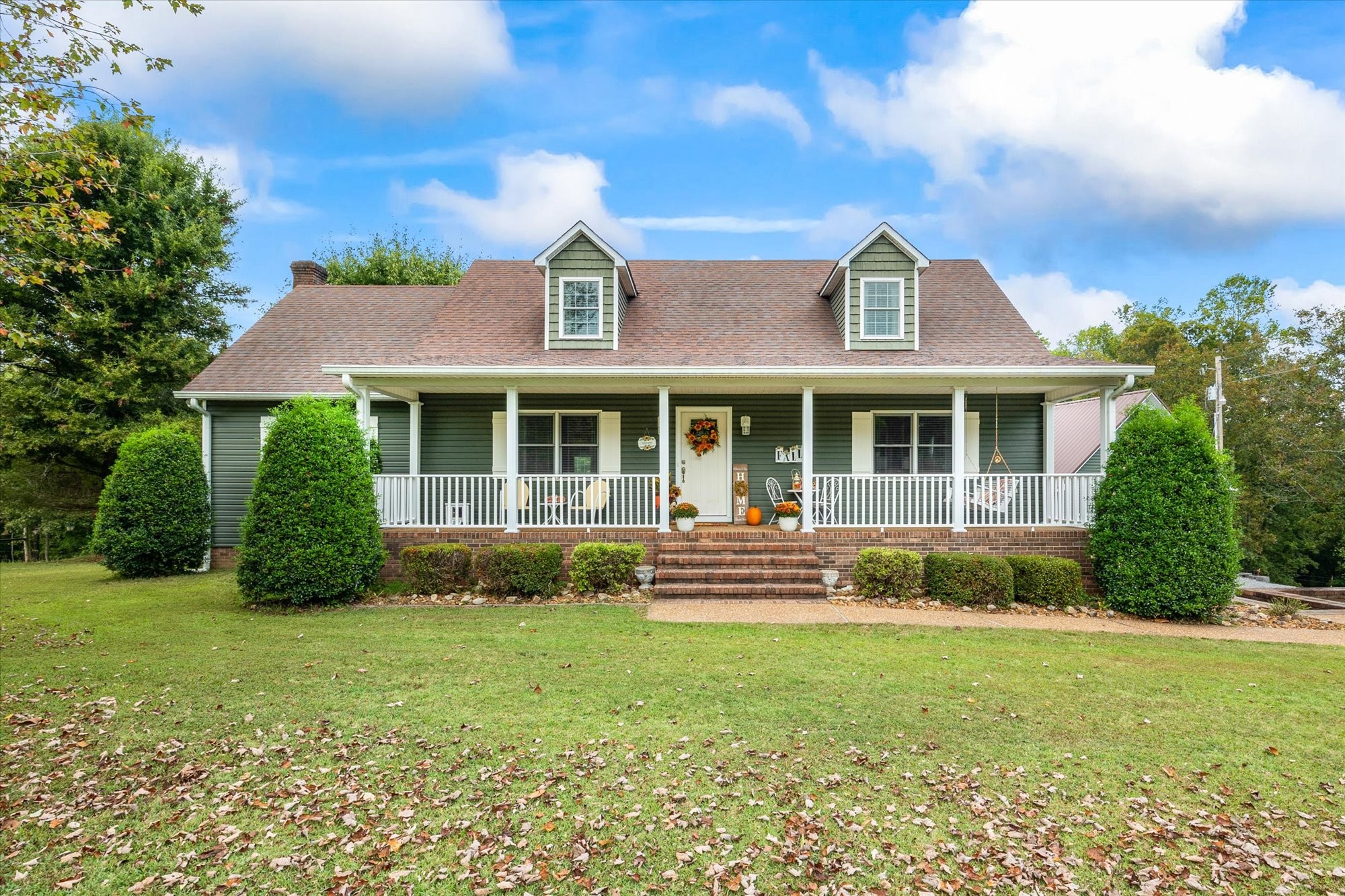 7214 Sarah Thomas Road Silver Point, TN 38582 - Photo 42 of 52 a front view of a house with a yard