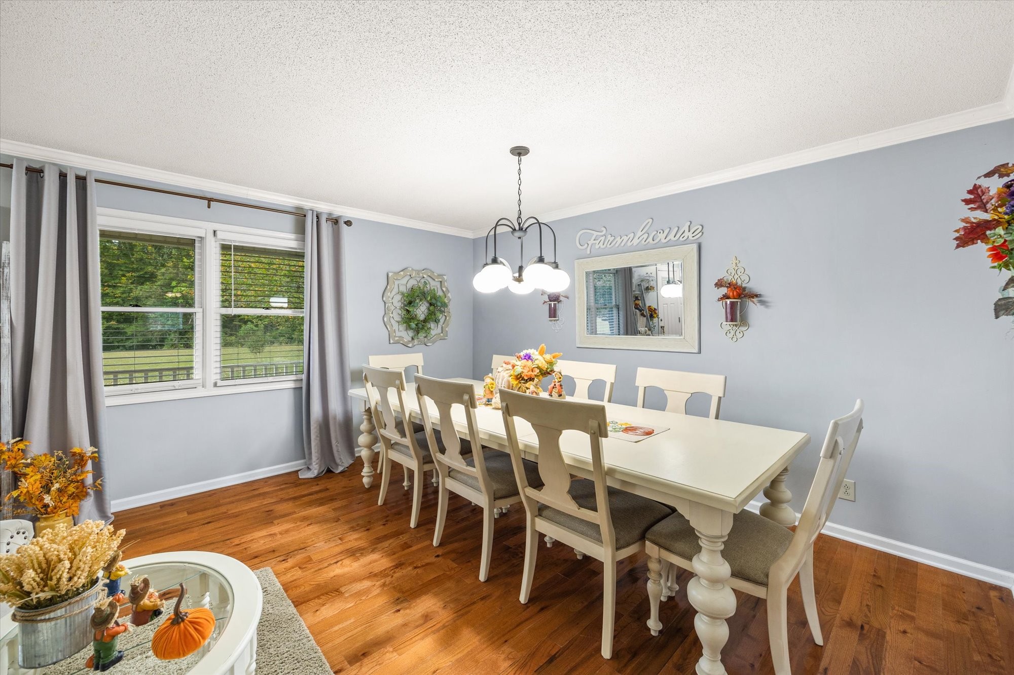7214 Sarah Thomas Road Silver Point, TN 38582 - Photo 5 of 52 a view of a dining room with furniture window and wooden floor