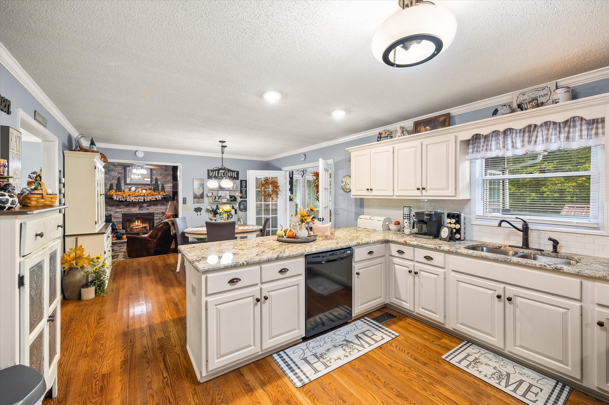 7214 Sarah Thomas Road Silver Point, TN 38582 - Photo 8 of 52 a kitchen with a sink stove and cabinets
