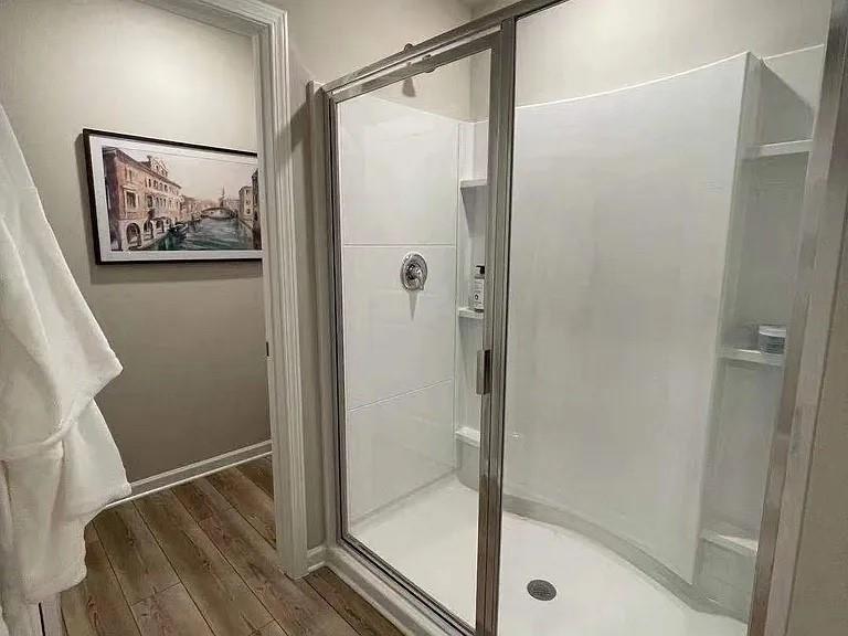 115 Wynn Way Pendergrass, GA 30567 - Photo 12 of 22 a bathroom with a glass shower door