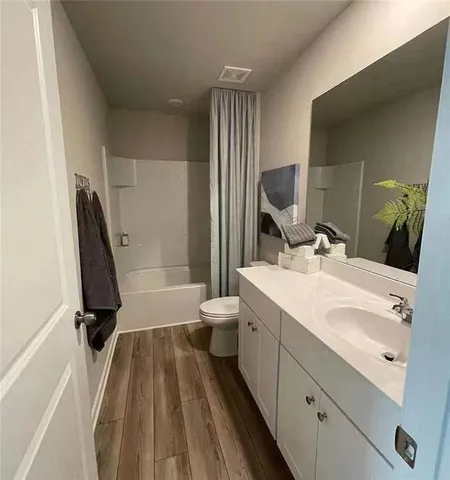 a living room with furniture and a lamp