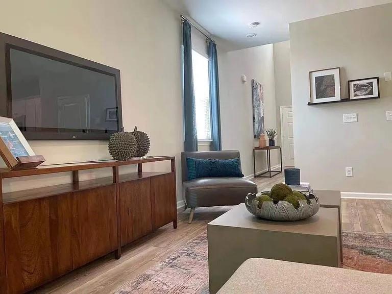 115 Wynn Way Pendergrass, GA 30567 - Photo 14 of 22 a living room with furniture and a lamp